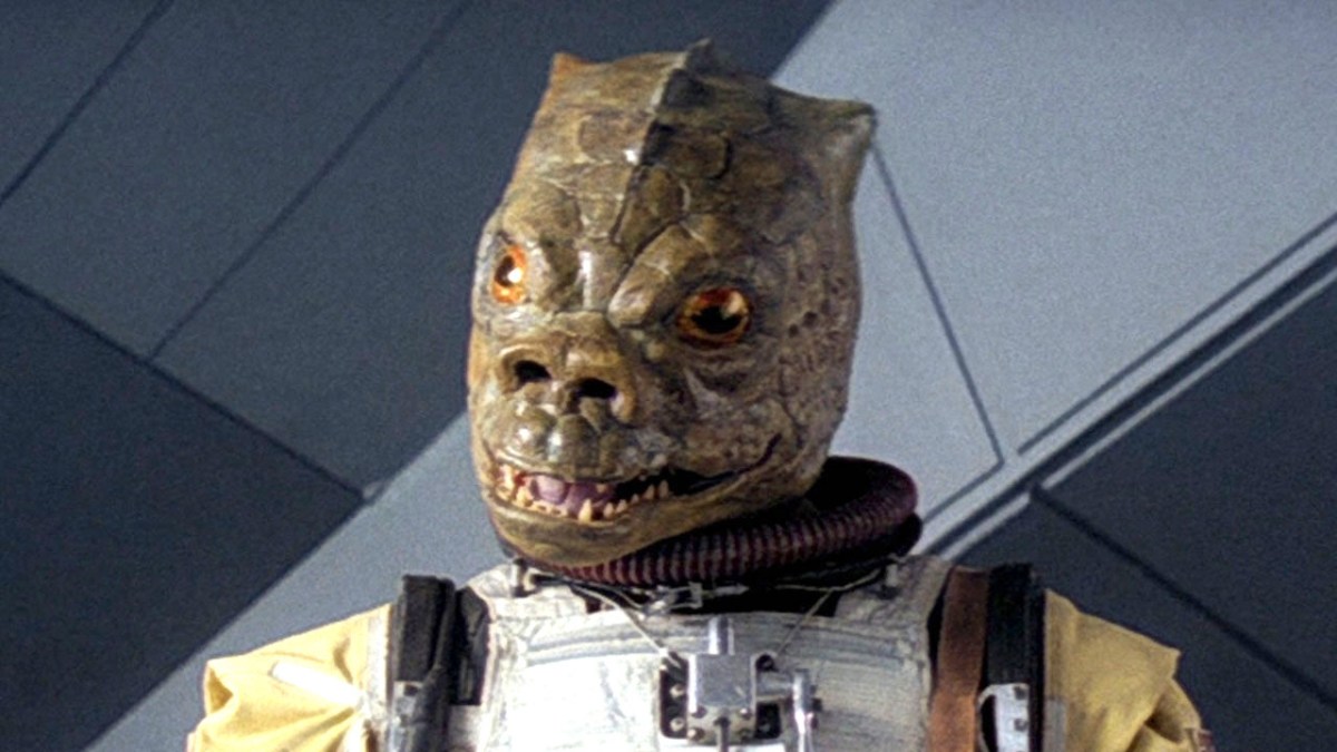 Bossk from Star Wars is looking straight ahead.