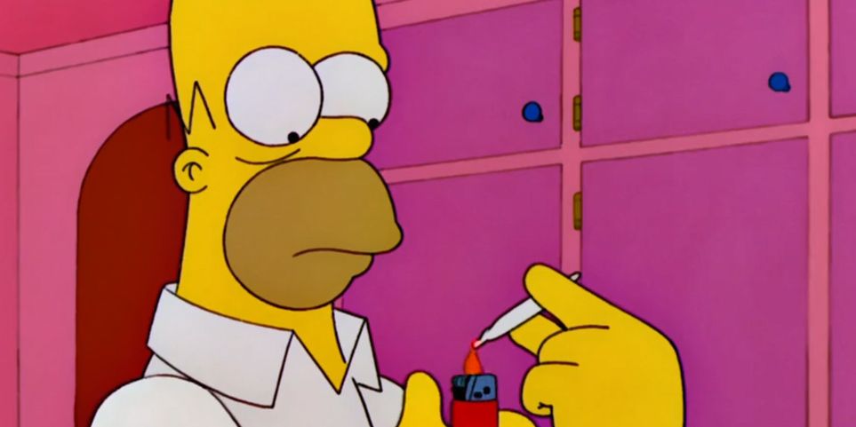 Homer is lighting a cigarette. 