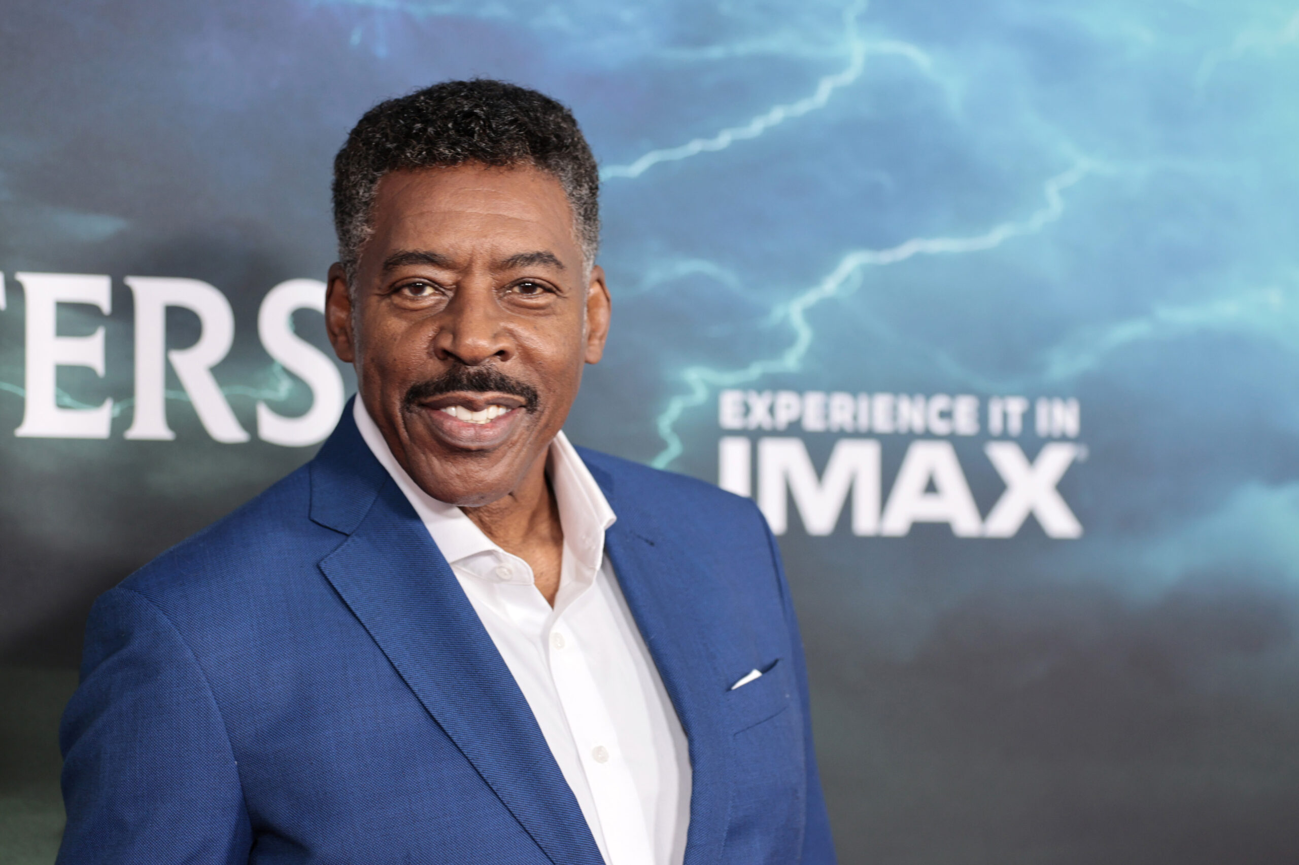 Ernie Hudson wearing a blue suit and white shirt at the Ghostbuster's premiere