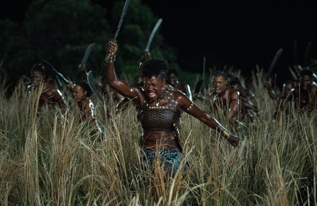 Viola Davis in character leading an army into battle in ‘The Woman King’