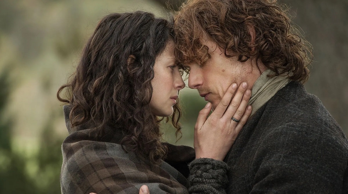 Caitriona Balfe as Claire Fraser and Sam Heughan as Jamie Fraser embrace in a still from “Outlander”