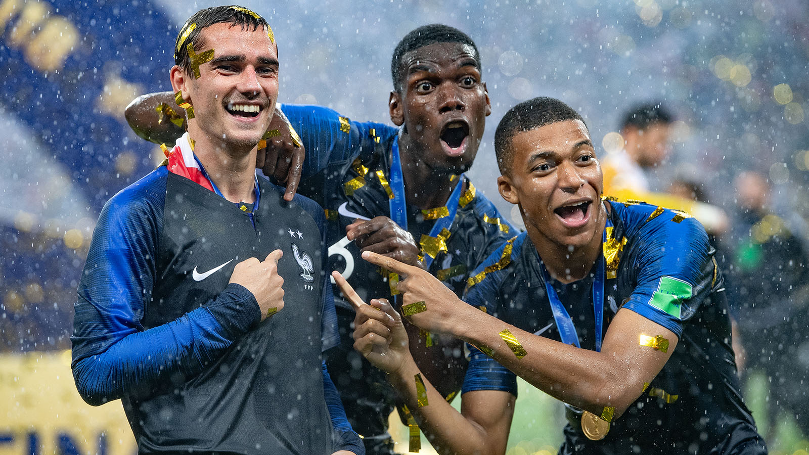 Antoine Griezmann, Paul Pogba, and Kylian Mbappe of France celebrate winning 2018 world cup