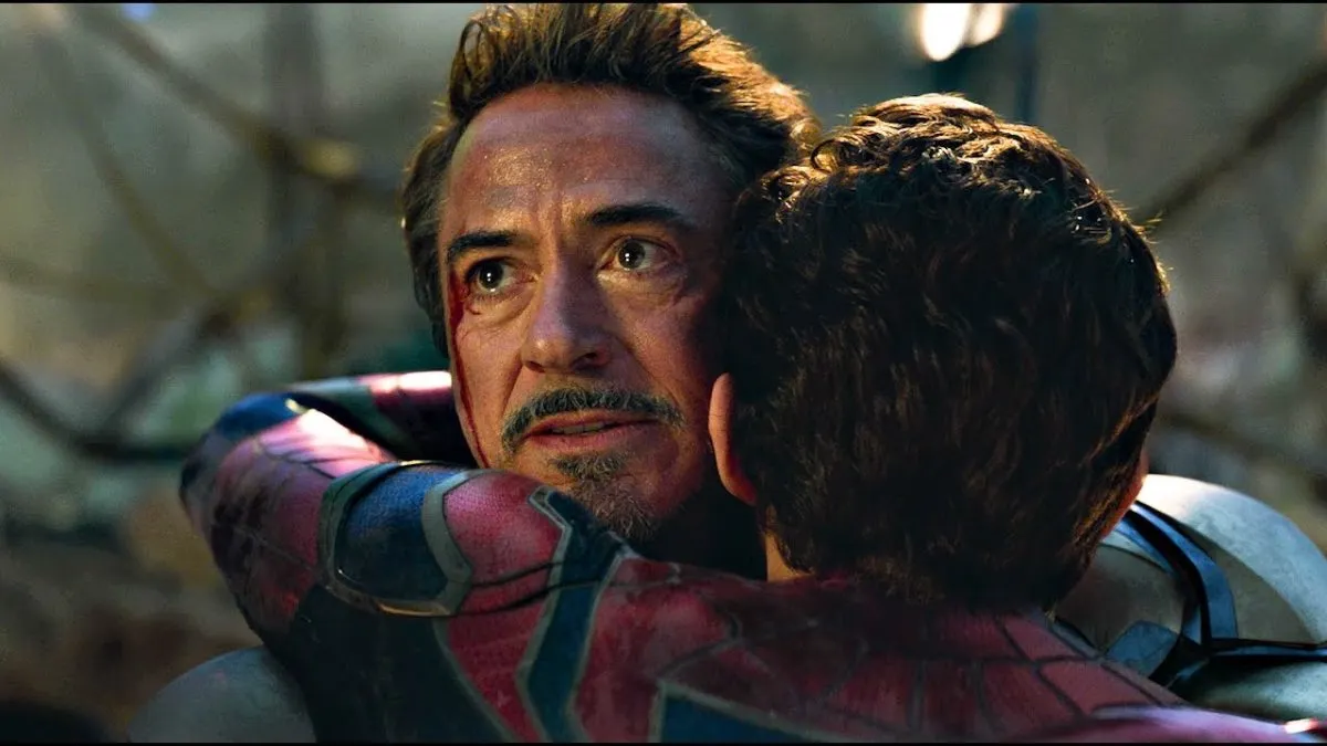 Iron Man and Spider-Man hug in Avengers: Endgame