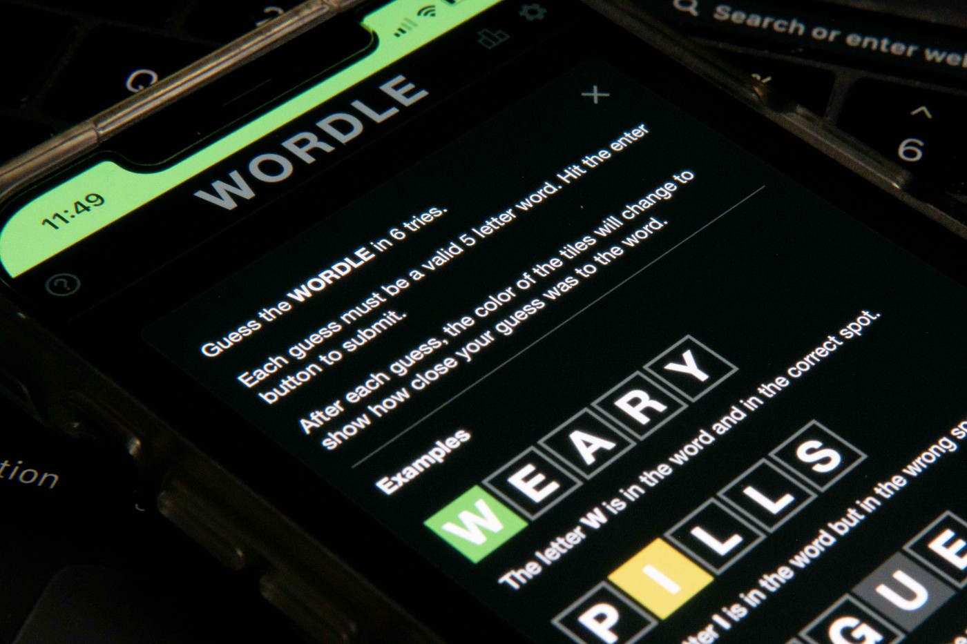 Worldle, the word-guessing game, is shown on a phone. 