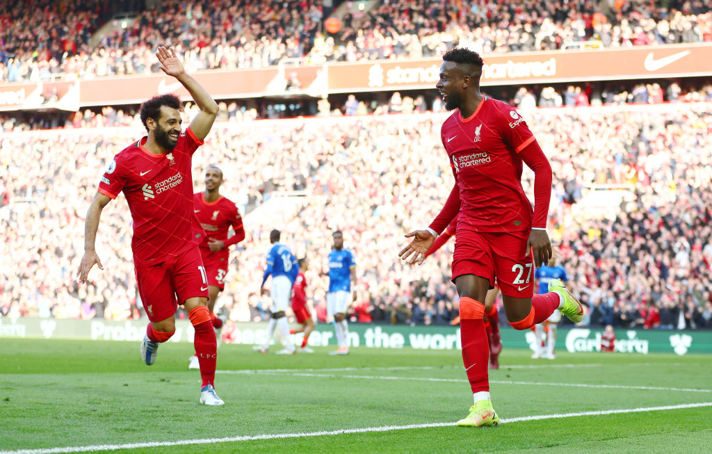 Divock Origi celebrates eith Mohamed Salah of Liverpool celebrate a goal.