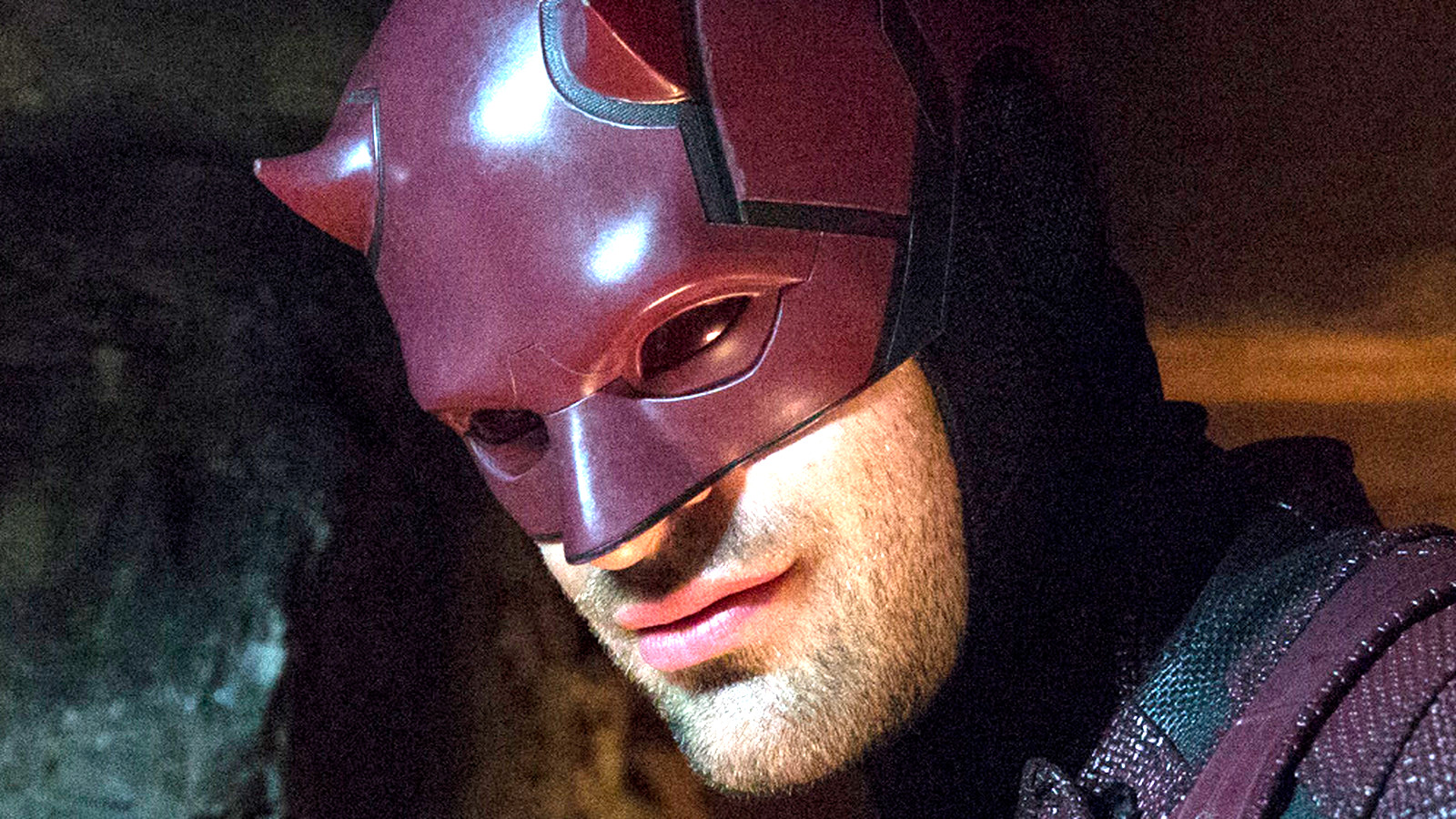 Charlie Cox in character as Daredevil, his face in semi-profile