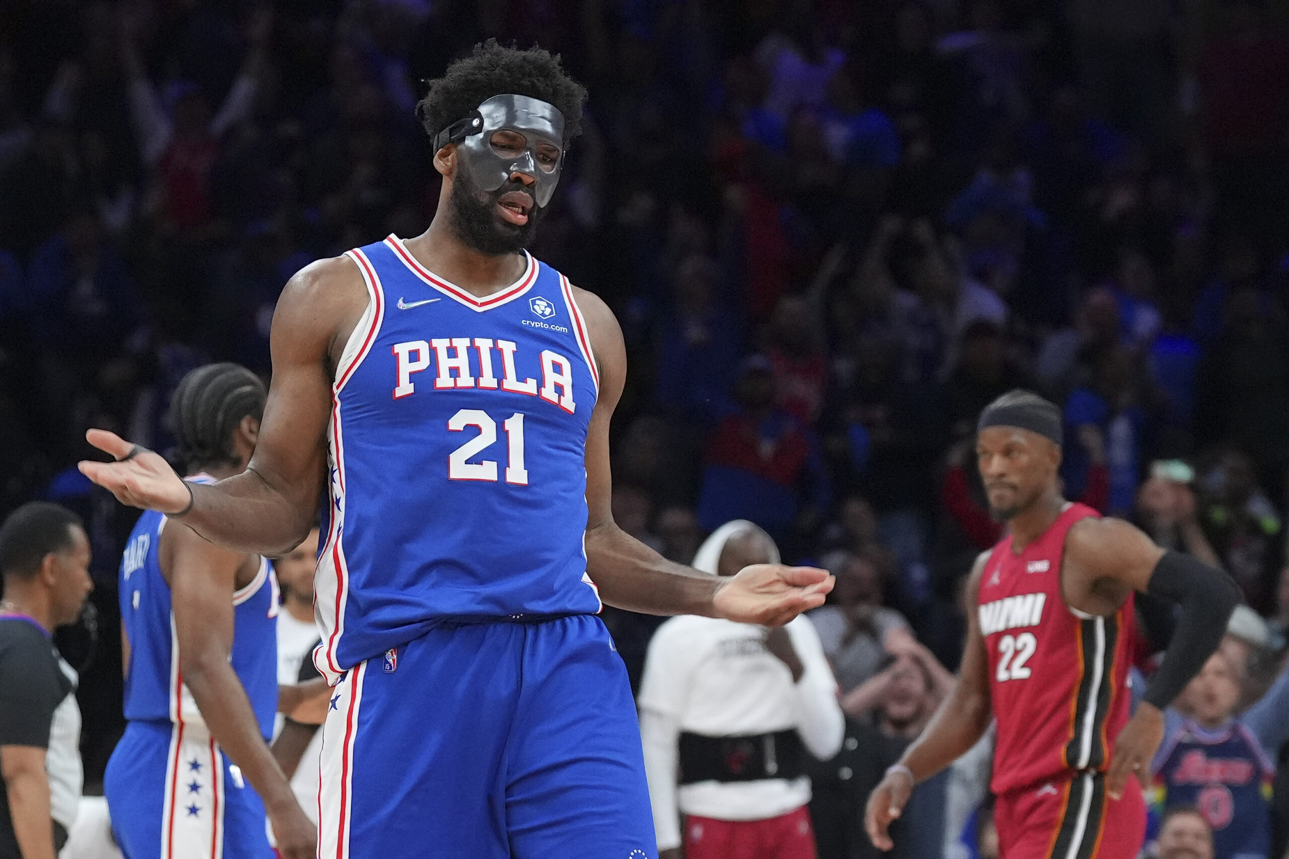 Joel Embiid wearing a protective face mask during an NBA game.