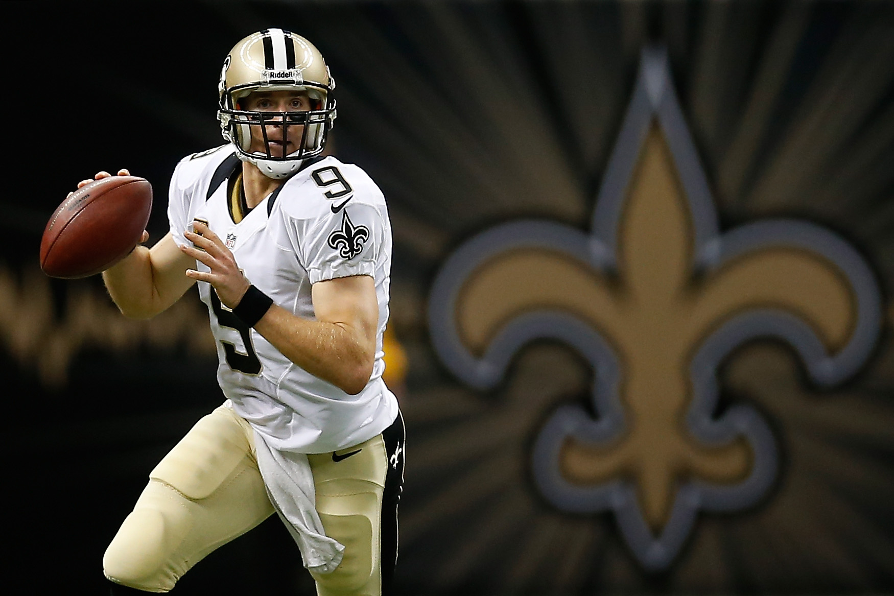 Drew Brees and the Saints logo.