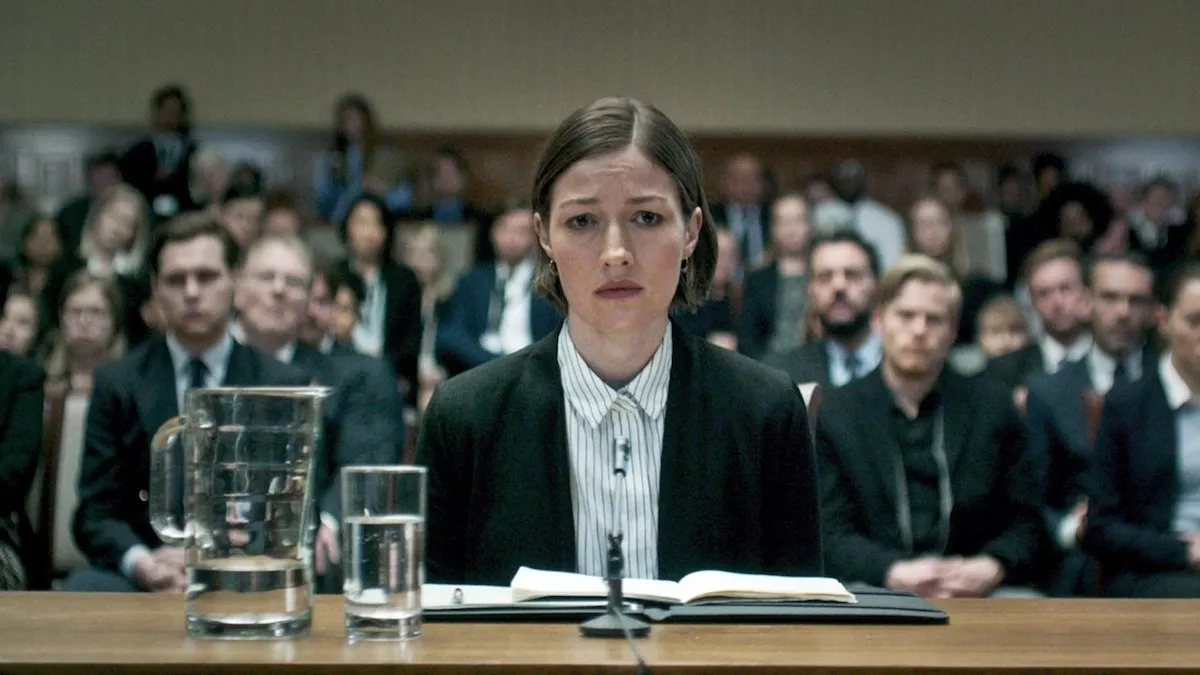 DCI Karin Parke (Kelly McDonald) appears fraught as she gives evidence at a public inquiry in 'Black Mirror: Hated in the Nation' 