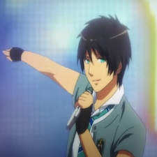 Ren holding a microphone and pointing to someone