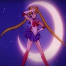 Sailor Moon standing in pose in front of crescent moon