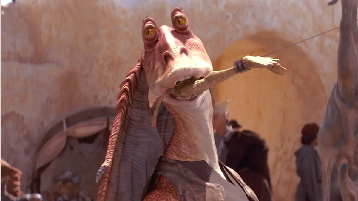 Jar Jar Binks has something in his mouth in Star Wars.