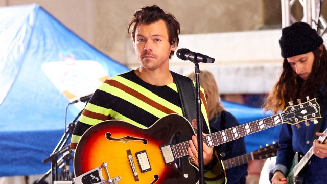 Harry Styles performs in a stripy outfit with his guitar on NBC's "Today" at Rockefeller Plaza