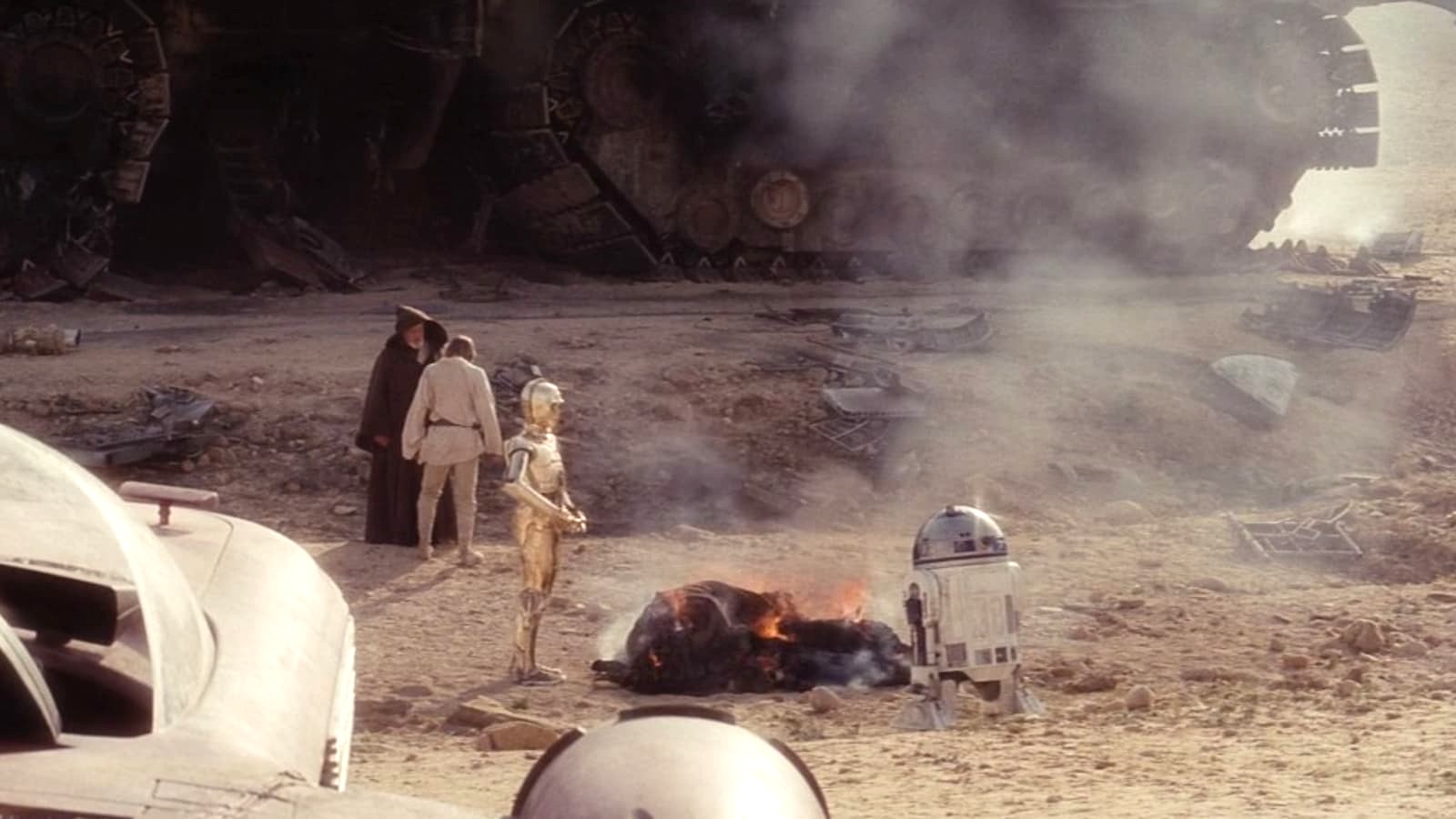 C3PO and R2D2 burning the Jawas in Star Wars