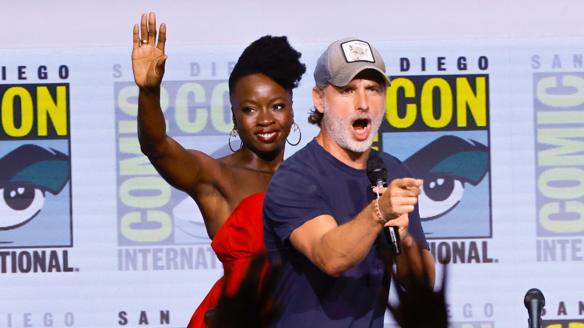 SAN DIEGO, CALIFORNIA - JULY 22: (L-R) Scott M. Gimple, Danai Gurira, and Andrew Lincoln speak onstage at AMC's "The Walking Dead" panel during 2022 Comic-Con International: San Diego at San Diego Convention Center on July 22, 2022 in San Diego, California.