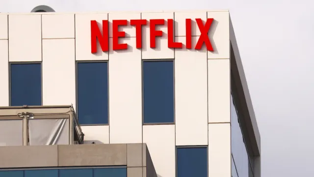Netflix logo on the outside of the company's white LA headquarters