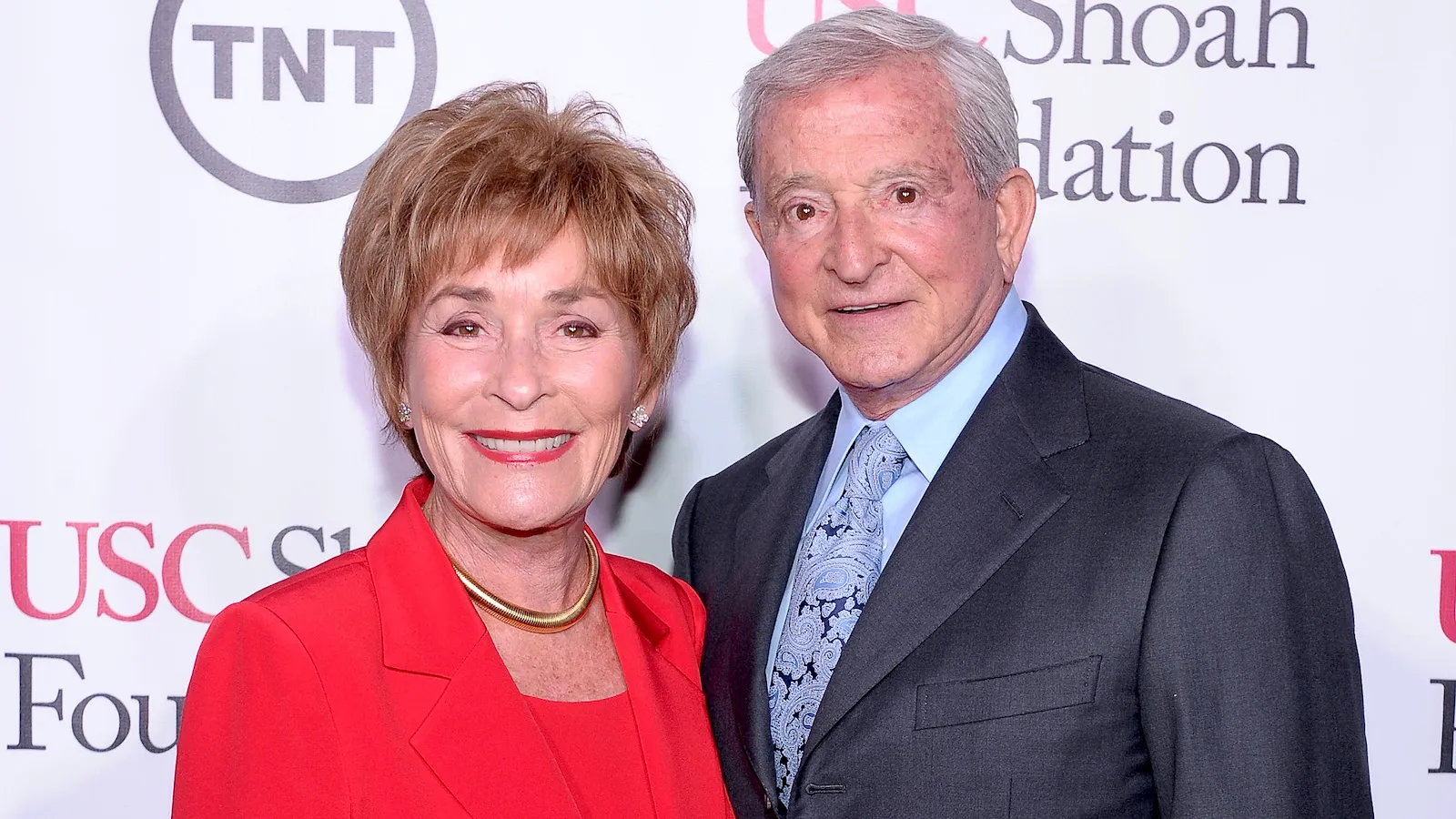 Judge Judy standing beside her husband Jerry Sheindlin on the red carpet