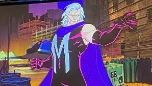A slightly grainy image of an animated Magneto (a white man with long hair) wearing a top with a big M on his chest, pointing one arm forward with a stern look on his face.