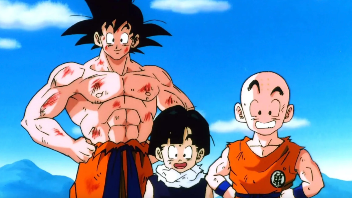 Goku is standing shirtless next to two other Dragon Ball characters.