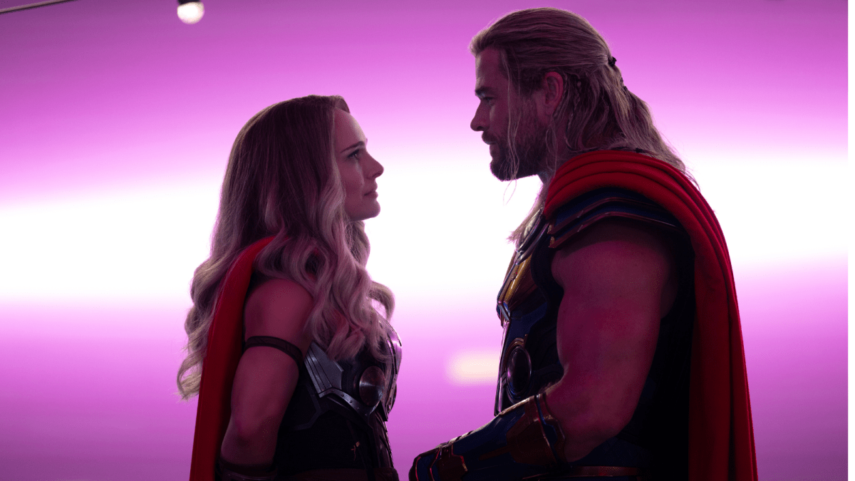 Natalie Portman as Mighty Thor and Chris Hemsworth as Thor face each other in a romantic silhouette from ‘Thor: Love and Thunder’