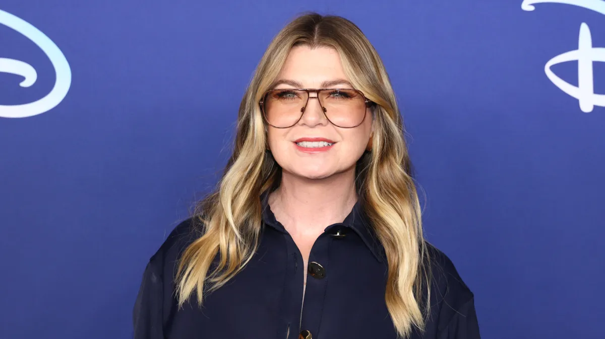 Ellen Pompeo attends the 2022 ABC Disney Upfront at Basketball City - Pier 36 - South Street on May 17, 2022 in New York City, wearing a blue blouse and aviator-style glasses.