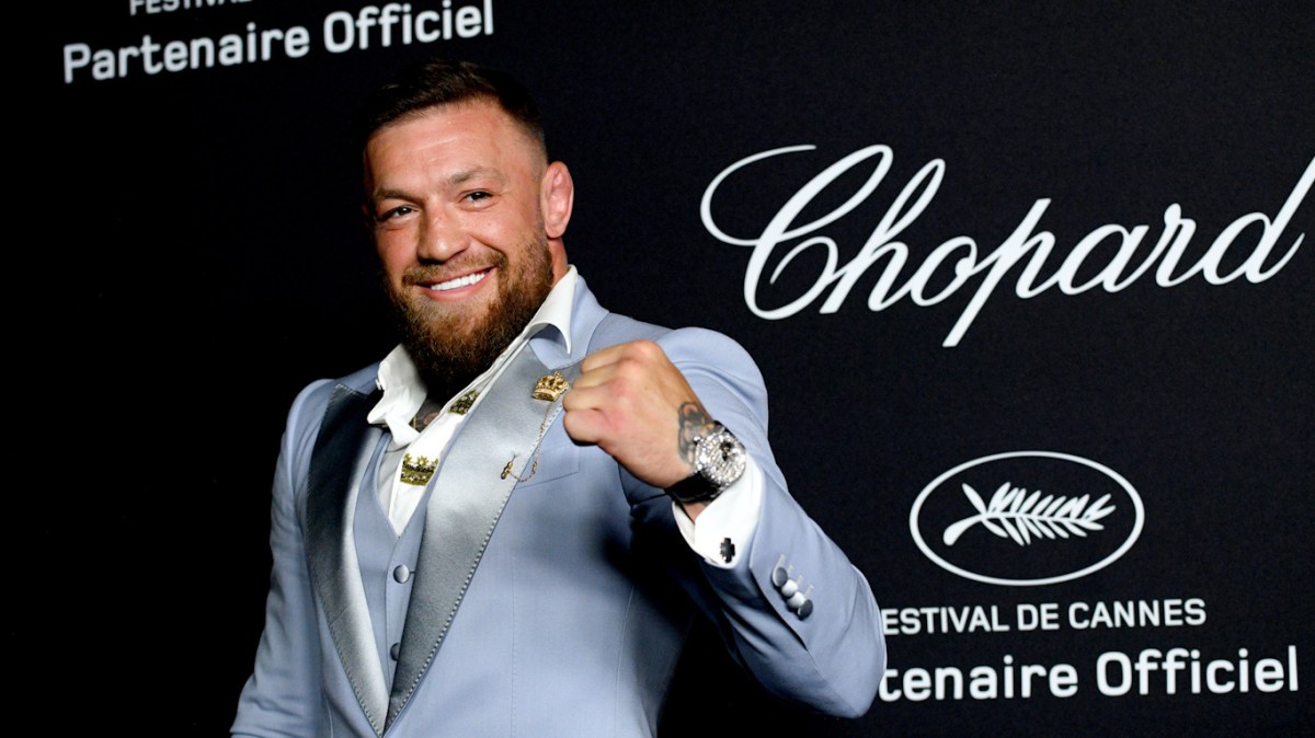 Conor McGregor attends the 'Chopard Loves Cinema' gala dinner during the 75th Cannes Film Festival at Hotel Martinez on May 21, 2022 in Cannes, France, posing with a raised fist and a smile