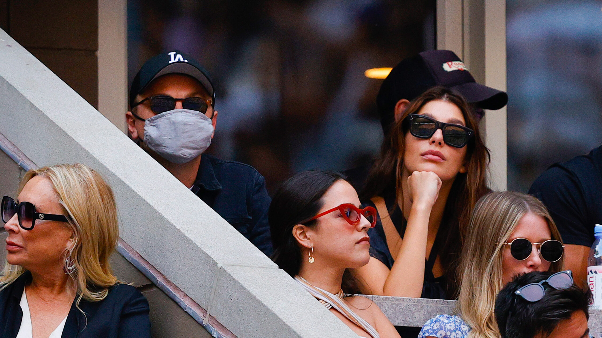 Actor Leonardo DiCaprio and his girlfriend, model/actress, Camila Morrone watch the Men's Singles final match between Daniil Medvedev of Russia and Novak Djokovic of Serbia on Day Fourteen of the 2021 US Open at the USTA Billie Jean King National Tennis Center on September 12, 2021 in the Flushing neighborhood of the Queens borough of New York City.