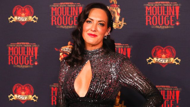 Simone Kessell attends opening night of Moulin Rouge! The Musical at the Capitol Theatre on June 04, 2022 in Sydney, Australia in a shimmery gown and side-parted hair
