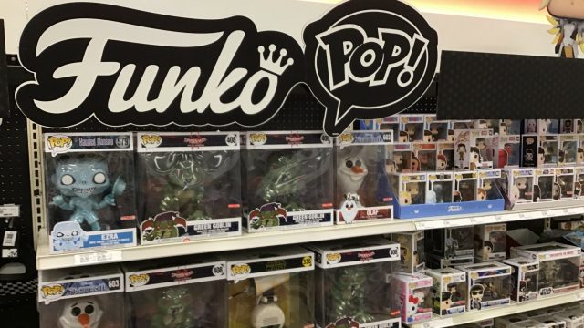 Store shelves filled with various Funko Pop figurines