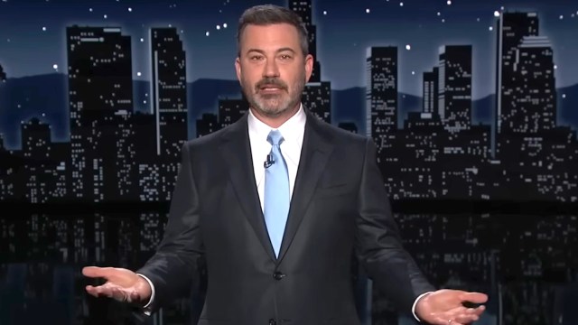 Jimmy Kimmel delivering a monologue on Jimmy Kimmel Live wearing a black suit and light blue tie