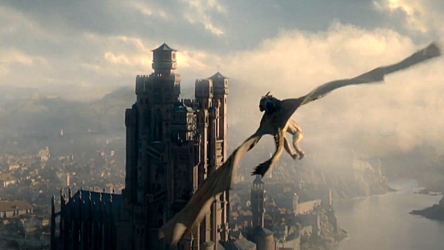 An airborne dragon flaps over King’s Landing