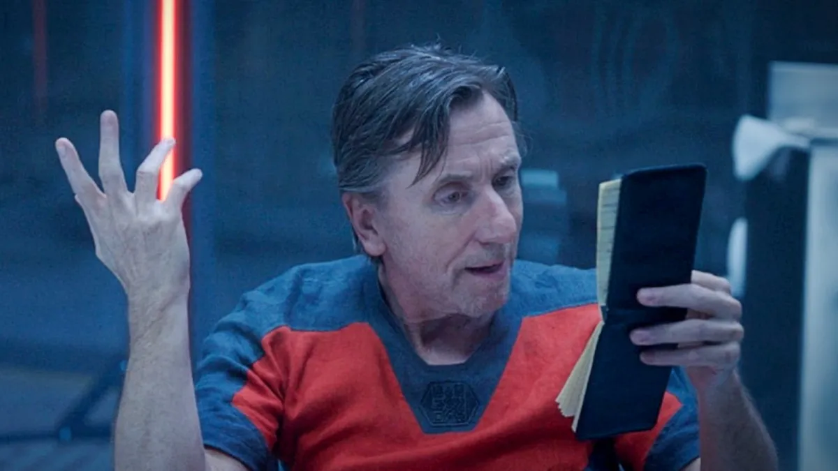 Tim Roth in character as Emil Blonsky reads from a small notebook in a scene from ‘She-Hulk: Attorney at Law”