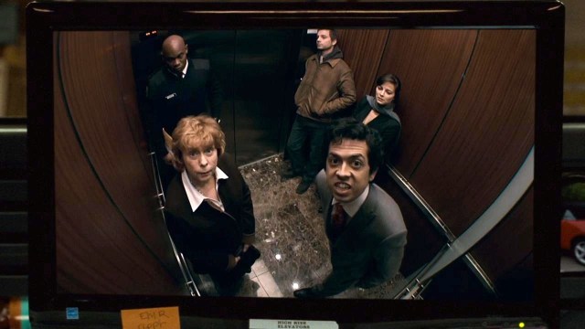 A still from “Devil” showing the cast staring into the camera