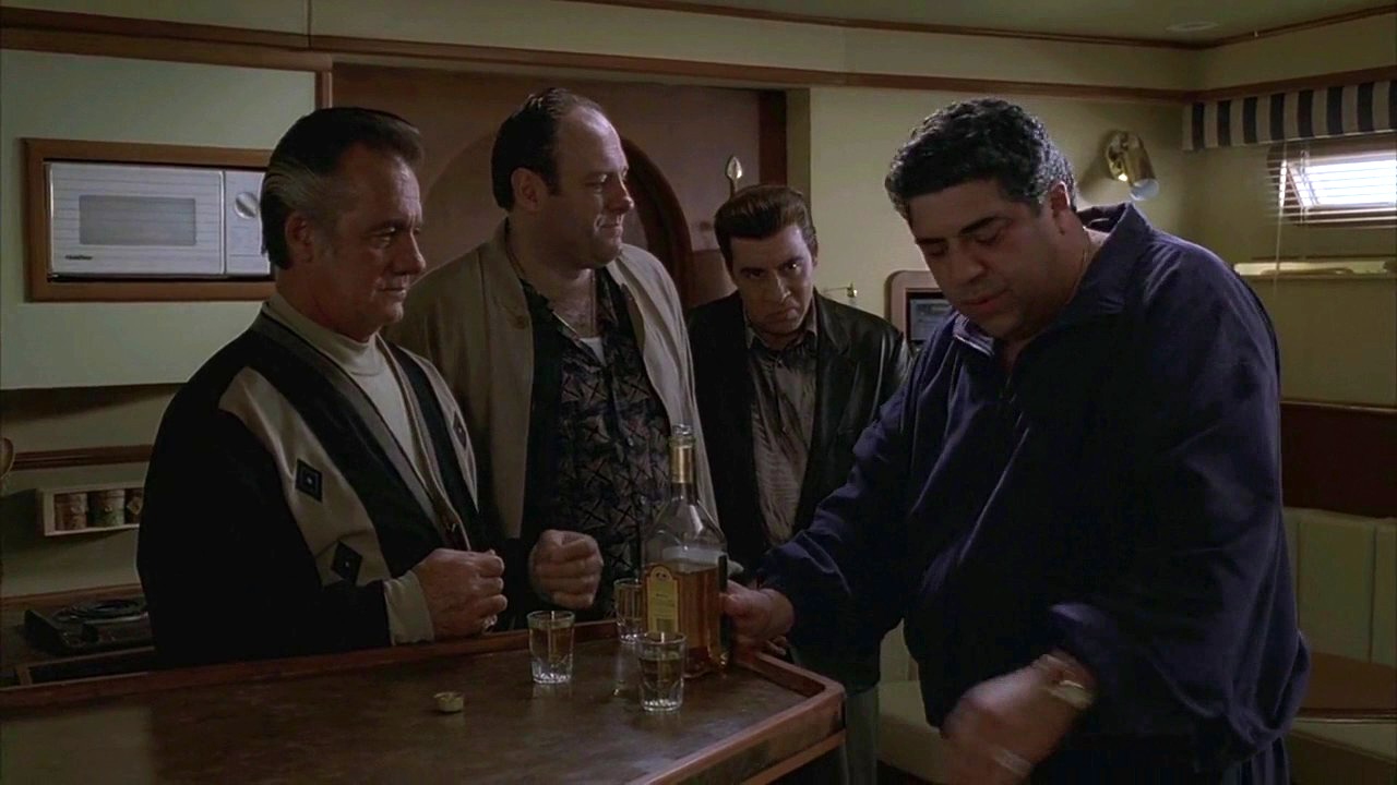 The gang from The Sopranos stand together for a drink. 
