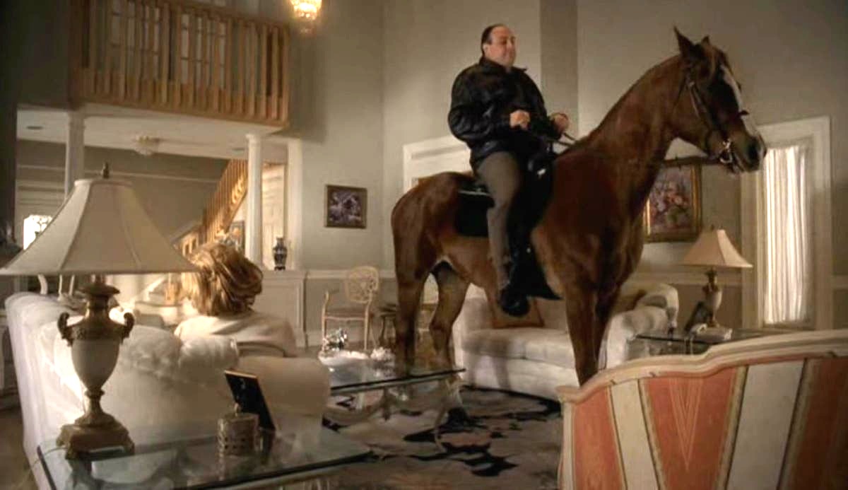 Tony from The Sopranos finds himself in an odd position, on a horse in a living room.