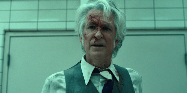 Matthew Modine in-character as Papa, his face bloodied