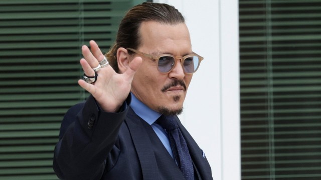 Actor Johnny Depp takes a break during his trial at a Fairfax County Courthouse on May 27, 2022 in Fairfax, Virginia. Closing arguments in the Depp v. Heard defamation trial, brought by Johnny Depp against his ex-wife Amber Heard, begins today.