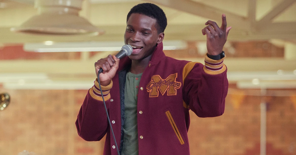 Jackson Marchetti (Kedar Williams-Stirling) serenades an off-screen Maeve with a song in 'Sex Education' 