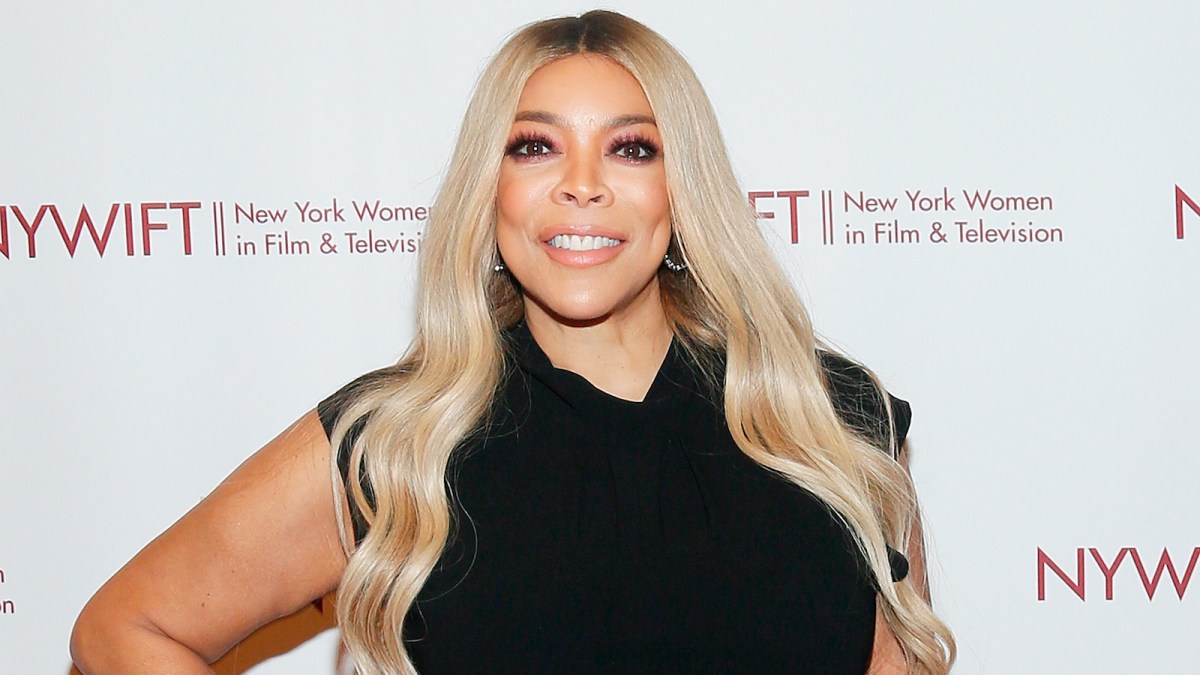 Wendy Williams sports long blonde hair and a black dress on the red carpet