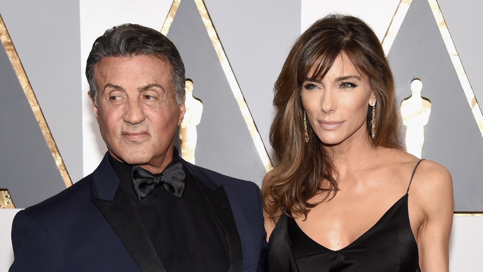 Sylvester Stallone and Jennifer Flavin attend the 88th Annual Academy Awards at the Hollywood & Highland Center on February 28, 2016 in Hollywood, California.