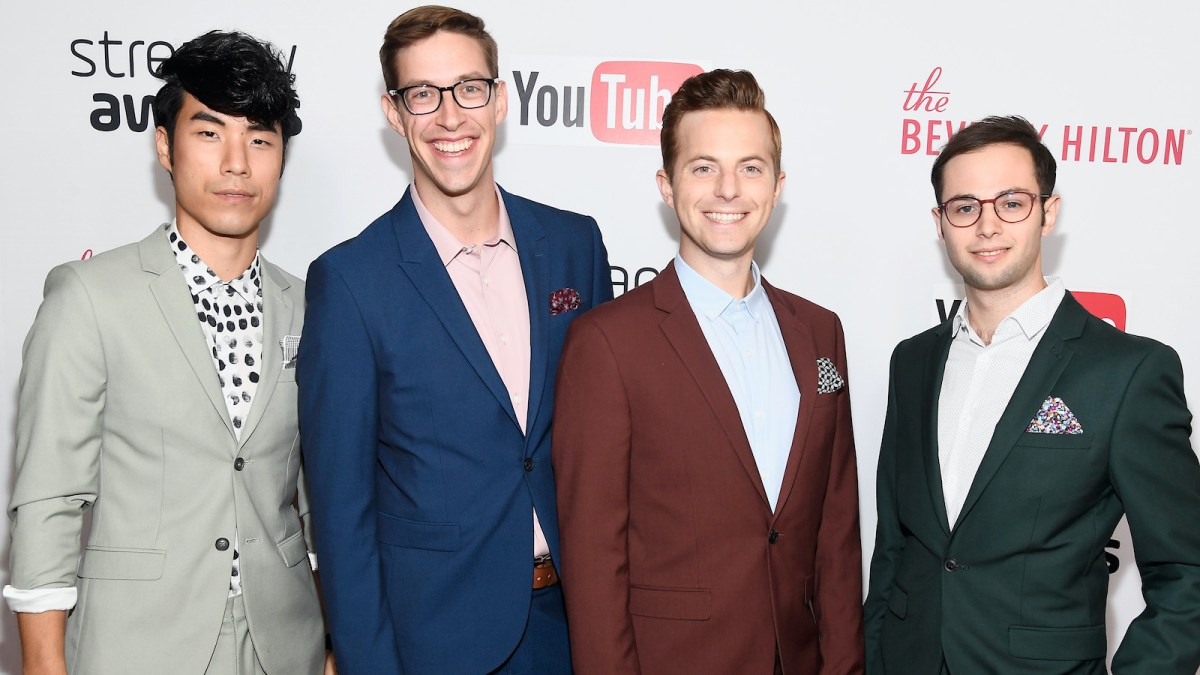 The Try Guys take a group photo on the red carpet of the Streamy Awards, each dressed in suits