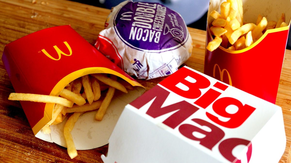 McDonalds fries and Big Mac spread out on a table