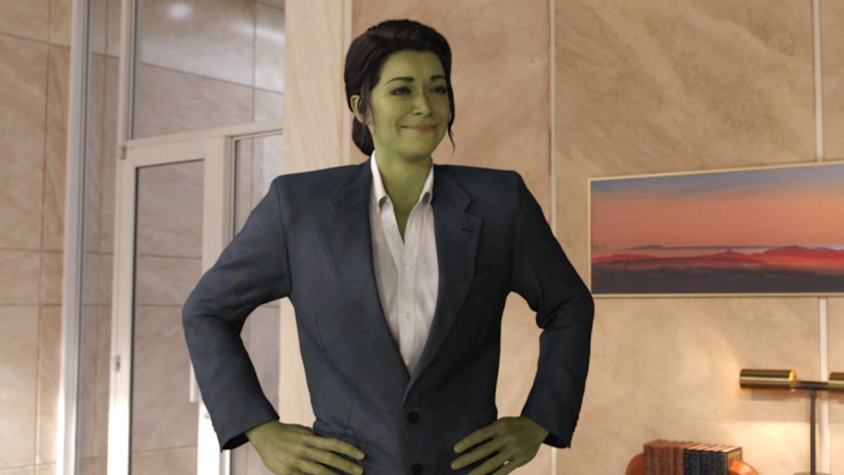Tatiana Maslany as Jennifer Walters in She-Hulk form wearing an oversized suit