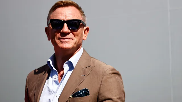Actor Daniel Craig attends pre-race ceremonies prior to the NASCAR Cup Series Bank of America ROVAL 400 at Charlotte Motor Speedway on October 10, 2021 in Concord, North Carolina.