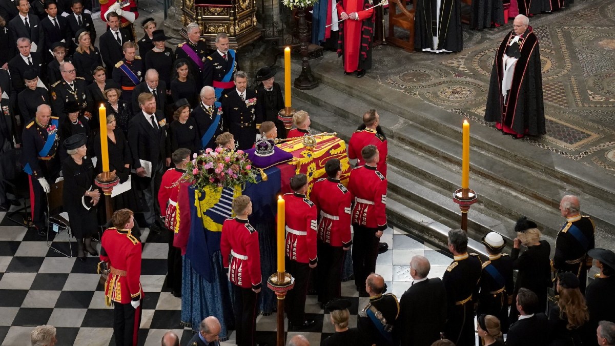Mourners surround the coffin of Queen Elizabeth II at her funeral in England.
