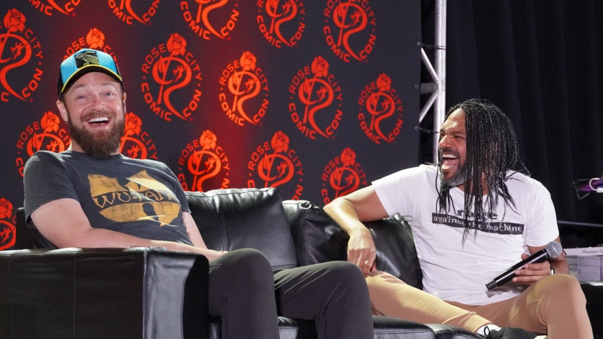 Ross Marquand and Khary Payton host a panel at a Comic Con event.