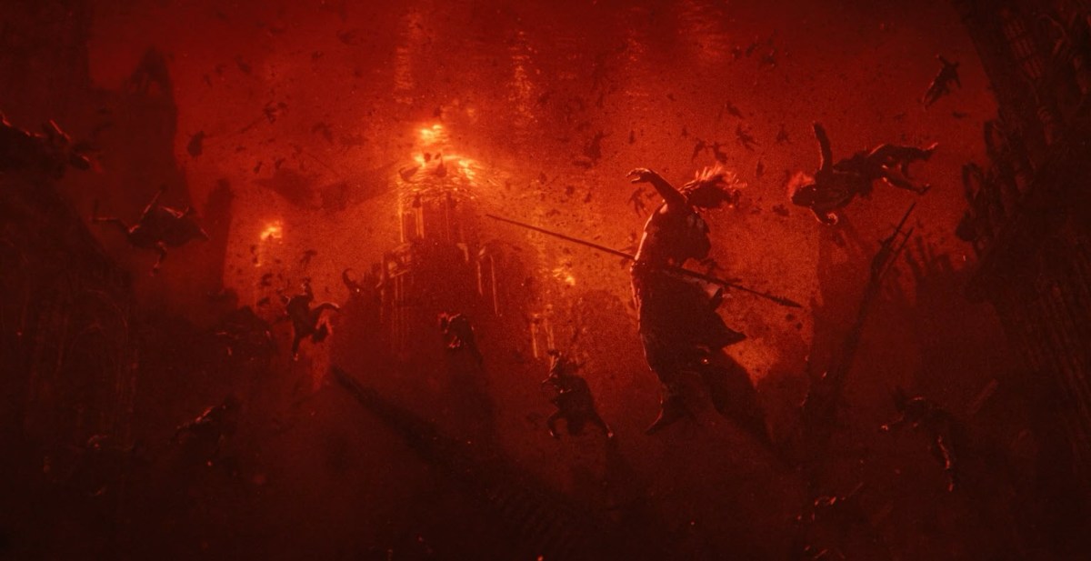 Different species from The Lord of the Rings preparing for battle against a red backdrop