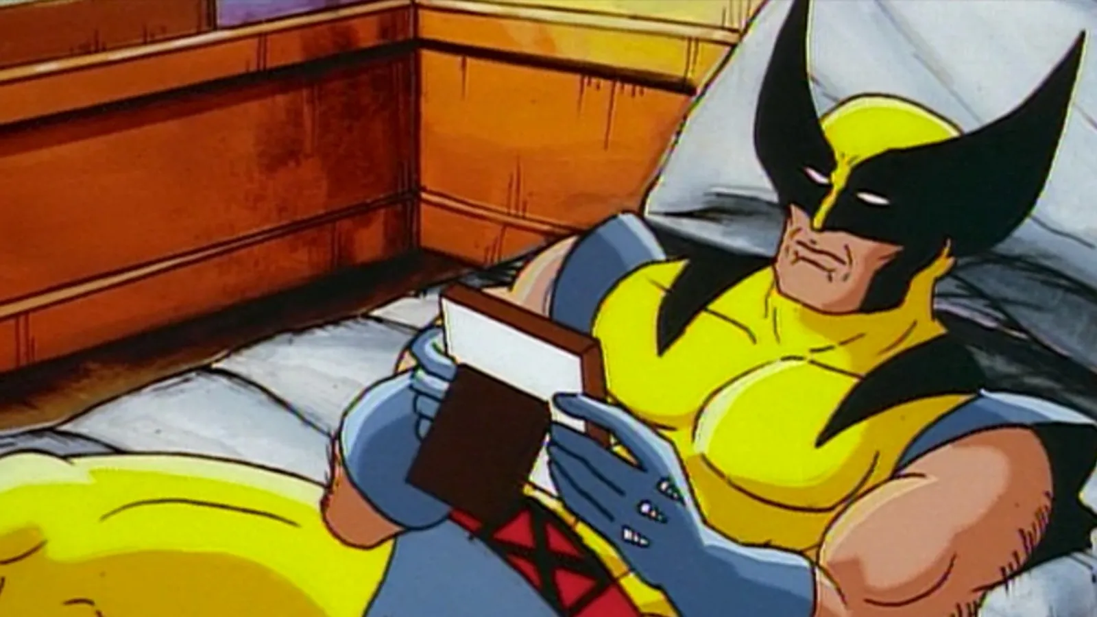Cartoon Wolverine relaxes in bed looking at a framed photo