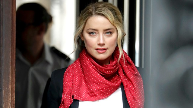 Amber Heard wearing a red bandana as a scarf