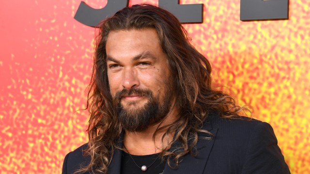 Jason Momoa sporting signature long hair on the red carpet